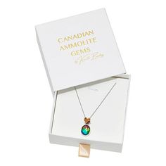 Canadian Ammolite Gems Oval Ammolite and Multigem Pendant with Chain Looking for colorful, original jewelry designs to elevate your style? Look no further than Canadian Ammolite Gems jewelry. This rare gem from Alberta, Canada features a kaleidoscope of natural colors and pairs beautifully with the citrine, garnet and opal stones in this outstanding pendant design. By Kenneth Bradley.        Pendant approx. 15/16"L x 15/16"W     Chain approx. 18"L x 1/16"W with 2" extender     Stamped .925; rhod Multi-stone Oval Pendant Necklace For Gift, Multi-stone Oval Pendant Jewelry Gift, Oval Pendant Multi-stone Jewelry Gift, Oval Multi-stone Pendant Jewelry Gift, Oval Pendant Multi-stone Jewelry For Gift, Original Jewelry Design, Colored Gemstones, Color Bands, Pendant With Chain