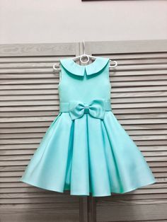 Teal mint turquoise pageant interview dress with bow belt and collar/ Knee length dress/ Girl Interview outfit /Custom pageant dress This beautiful dress is made from high quality satin. This material has a shape and less shine. The dress has natural lining and zipper back. It is easy to care and comfortable to wear. The dress comes in knee length. It has tulle petticoat. The dress is perfect for interview competition and other pageant events. It is absolutely stunning on! Materials Satin, visco Elegant Green Pageant Dress For Dress-up, Elegant Green Pageant Dress, Elegant Green Pageant Dress For Party, Light Blue Elegant Dress For Dress-up, Elegant Light Blue Dress For Dress-up Occasions, Elegant Light Blue Dress For Dress-up, Blue Dress-up Dress With Bow, Elegant Light Blue Pageant Dress For Parties, Elegant Light Blue Pageant Dress