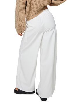 Cotton and linen add airy ease to slouchy wide-leg cargo pants topped with a comfortable elastic-drawstring waist. 70% cotton, 30% linen Machine wash, line dry Imported Linen Wide Leg Parachute Pants With Side Pockets, Wide Leg Linen Parachute Pants With Side Pockets, Wide Leg Cargo Pants With Pockets For Day Out, Linen Cargo Bottoms For Loungewear, Chic Linen Cargo Pants, Summer Loose Fit Linen Cargo Pants, Chic Wide Leg Linen Cargo Pants, Linen Cargo Pants With Elastic Waistband For Loungewear, Wide Leg Linen Cargo Pants For Loungewear