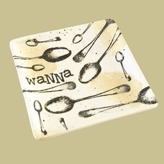 a ceramic plate with spoons and utensils on it that says wanna