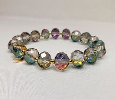 "Crystals and glass are used in the construction of this bracelet, which is beautifully handcrafted. Featuring High Quality AB Rainbow Plated Austria Crystal Glass Beads with 14kt gold plated half moon charm and accent beads. With its versatile bead assortment, this bracelet goes with any outfit. You will be able to show off your unique style and make your wrist the center of attention. Most of my bracelets fit wrists between 6\" and 6.5\" in size. Before placing an order, please confirm your size. Thank you" Gold Czech Glass Beaded Bracelets, Gold Glass Bracelets With Faceted Beads, Gold Glass Beaded Bracelets, Glass Beaded Bracelet, Crystal Beads Bracelet, 25 May, Glass Beaded Bracelets, Moon Charm, Pink Crystal