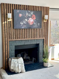 a living room with a fireplace and large painting on the wall above it's mantle