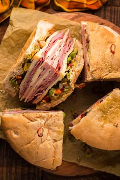 several sandwiches with meat and vegetables on them