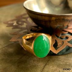 The 'Anyang Royal Jade Ring' symbolizes the ancient Chinese city of Anyang, the birthplace of Chinese civilization 3000 years ago. This beautiful piece symbolizes strength and legacy through its robust and striking design. Materials: 3.75g 14K gold, 0.6g Jade Dimensions: 25.89 x 20.25 x 15 mm Gross Weight: 4.35g Spiritual Ceremonial Rings With Polished Finish, Oval Spiritual Ring With Polished Finish, Oval Spiritual Rings With Polished Finish, Spiritual Gold Emerald Ring, Gold Emerald Ring With Spiritual Style, Spiritual Gold Emerald Ring With Gemstone, Traditional Oval Signet Ring With Polished Finish, Traditional Oval Emerald Ring, Traditional Oval Rings With Polished Finish