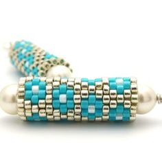 the beaded bracelet is made with turquoise and white beads