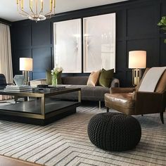 a living room filled with furniture and a chandelier