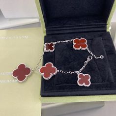 This exquisite CLOVER 5 MOTIFS SILVER CARNELIAN BRACELET is a true symbol of luck and elegance. Crafted with premium silver and adorned with five vibrant carnelian motifs, this bracelet is the perfect addition to elevate any outfit. Indulge in luxury and sophistication with this stunning piece of jewelry. ADDITIONAL INFORMATION Color: Silver Stone: Carnelian Ref. od900 Material:- 925 Sterling Silver - 18k Gold Plated- 18k Real Gold ( contact us via instagram) Length: 19 cm Our replica products a Luxury Red Sterling Silver Jewelry, High-quality Classic Jewelry For Gifting, Luxury Aaa Quality Bracelet, Luxury Red Sterling Silver Bracelets, Luxury Sterling Silver Diamond Bracelet, Designer Red Bracelet Jewelry, High-end Silver Jewelry For Gifts, Elegant Red Sterling Silver Bracelet, Trinity Bracelet