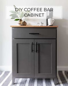 the diy coffee bar cabinet is painted in dark gray and has a wooden top