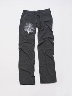 "These grey lounge pants have an elastic pull on waist with a drawstring, 2 small front pockets, unfinished hems and a faux back pocket. They are perfect for around the house- lounging, walking, throw on over some short shorts after your workout or as pajamas! I print my Tree in white on the front of the right upper leg. Please refer to the sizing guides below to find your best fit. Measurements are all taken while pants are laying flat, waist is doubled. expect minor shrinkage after washing in Fall Loungewear Yoga Trousers, Relaxed Fit Cotton Yoga Pants For Loungewear, Cotton Sleep Pants For Fall, Fall Cotton Sleep Bottoms, Casual Sleep Bottoms For Fall, Casual Fall Sleep Bottoms, Comfortable Cotton Yoga Pants For Loungewear, Stretch Cotton Pants For Sleep, Stretch Cotton Sleep Pants