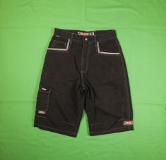 "Vintage Y2K Kikwear K Dub raver shorts with stash pocket Color: Black Size: Tagged 31, see measurements Actual Measurements: Waist: 30\" Inseam: 13\" Rise: 13\" Leg Opening: 22\" Total Length: 26\" Good used condition. Does have a few flaws. Cuts on both back pocket top outside corner seams. Seems like a weird customization, maybe you would know. Also has light fading and overall wear. See pics for condition. Otherwise great shape. Ships in 1-3 business days via Priority Mail. International Shipping: We charge a flat rate for international shipping, if our shipping estimates are more expensive than the actual shipping costs, we refund the majority of the difference. All items are listed with integrity and to the best of our ability. ALL SALES ARE FINAL, so please ask questions, read measu Y2k Streetwear Short Pants, Y2k Short Pants For Streetwear, Black Y2k Shorts For Streetwear, Black Y2k Style Shorts For Streetwear, Y2k Short Pants With Pockets, Y2k Style Short Pants With Pockets, Y2k Short Bottoms With Belt Loops, Y2k Style Short Bottoms With Belt Loops, Y2k Black Bottoms With Side Pockets