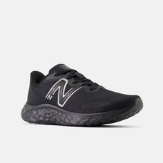 the new balance running shoe in black with white lettering on the upper part of the shoe