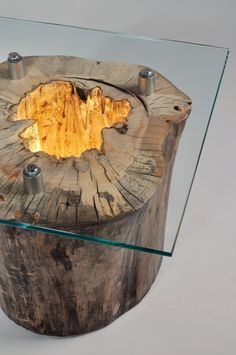 a wooden table with glass top on white background