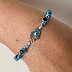 New Adjustable Hamsa Evil Eye Bracelet. Blue Evil Eyes. Blue Eye Inside Of The Beautiful Rhinestone Hamsa. Silver Accents. Adjustable Blue Jewelry With Silver Beads, Silver Beaded Evil Eye Bracelet For Gift, Silver Beaded Evil Eye Bracelet Gift, Adjustable Blue Sterling Silver Beaded Bracelet, Adjustable Sterling Silver Blue Beaded Bracelet, Blue Crystal Bracelet With Silver Beads, Blue Sterling Silver Beaded Bracelets As Gift, Handmade Blue Sterling Silver Beaded Bracelets, Blue Nickel-free Crystal Bracelet For Gift