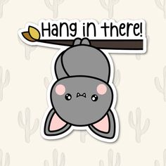 a sticker that says hang in there with a bat hanging from it's side