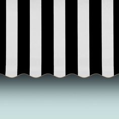 a black and white striped awning over water