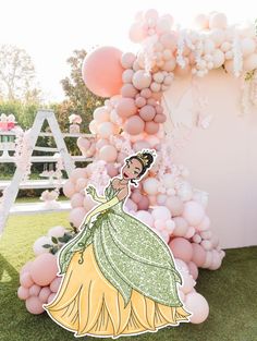 the princess and the frog balloon arch is made out of balloons, with a sticker on it