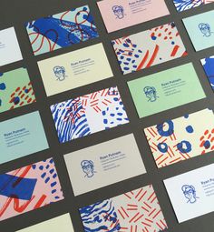 many business cards with different designs on them