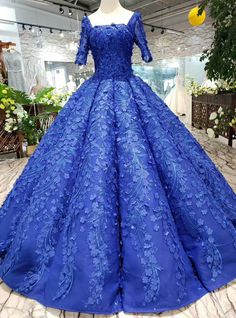 What can be more befitting for a princess on her big day than a royal blue ball gown, nothing! This piece by Kemedress is the creation of a perfect Cinderella in the most beautiful floral applique ever; just the perfect image of you to keep in the memory of all your loved ones still a day after forever. Royal Blue Ball Gown, Quince Dresses Blue, Blue Ball Gown, Haute Couture Wedding Dress, Square Fabric, Blue Ball Gowns, Applique Wedding, Blue Ball, Applique Wedding Dress