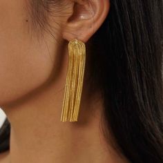 Make a bold statement with these Gold Fringe Earrings. Featuring unique Tassel Stud design, these statement earrings offer the perfect balance between elegance and flair. Stud Design, Gold Fringe, Long Tassel Earrings, Fringe Earrings, Tassel Earrings, Statement Earrings, Tassels, 18k Gold, Gold