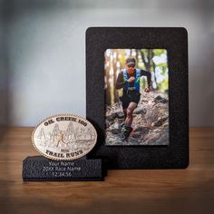 This 2 in 1 display  is versatile and customizable allowing you to showcase your journey and achievements in a unique way. The slot-in base makes it easy to rotate the frames or bib holders. You may choose the components based on the items you want to display. You can choose to have: -One 4x6 photo frame  -One bib holders with clips You may choose to personalize this display with the participants name, the event information, or other custom text.  Check out our other listings for variations of t Sports Shadow Boxes, Buckle Display, Personalized Shadow Box, Ultra Marathon, Awards Trophy, Trophies & Awards, 4x6 Photo, Boy Scouts, Name Plate