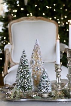 a tray with candles and christmas trees on it