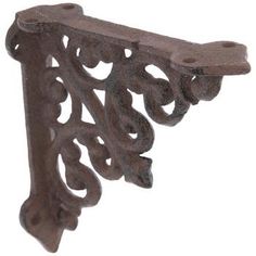 an ornate iron bracket on a white background