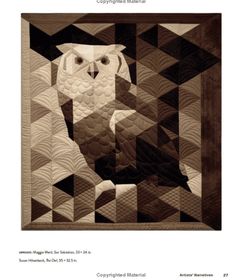 an owl is sitting in the middle of a quilt