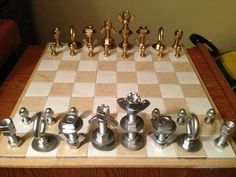 a chess board with metal pieces on it