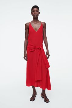 The womenswear team played with proportion when designing this striking midi dress. Offered in a cherry-red shade, it's crafted from fluid mulberry silk and shaped with a V-neckline, curved hem and sashes at the waist that can be tied to one side or fastened into a bow. Slim fit Shell: 100% Mulberry silk. Excluding trims / Dry clean Back length of size 6 is 50.15" / Model wears a size 6 Fall Dress Trends, Simple White Dress, My Wish List, Mens Cardigan Sweater, Linen Mini Dress, New Arrival Dress, Trending Dresses, Cherry Red, Mulberry Silk