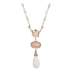 Stylish and finely detailed antique Victorian necklace crafted in 14k rose gold (circa 1880s to 1900s).    Carved coral measures17mm x 12mm and 20mm x 10mm. One large white stone measures 1 1/4 x 3/4 inch (believed to be bone).    The elaborate necklace highlights angel skin coral carved with the face of a woman and floral motif. Cutout fancy links in 14k rose gold with embossed and hand engraved floral motifs keep with the floral theme of the necklace. The necklace is larger in scale, measuring 20 inches in length, and makes a great statement.    The necklace is in good condition. We have not cleaned it in order to preserve the patina and collector value.    Particulars:    Weight: 25.5 grams    Stones: Carved coral measures17mm x 12mm and 20mm x 10mm. One large white stone measures 1 1/4 Gold Drop Necklace, Silver Drop Necklace, Victorian Necklace, Necklace Craft, Floral Theme, Accessories Jewelry Necklace, Drop Necklace, Hand Engraving, Antique Victorian