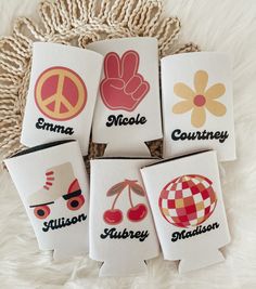 four personalized flasks with different designs on them