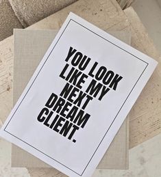 you look like my next dream client sticker on top of a piece of paper