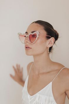 All the heart eyes for these pink sparkle sunnies! Perfect for your bachelorette trip for just yourself or to match with your best girls. Styled here with our Party Girl Mini. Heart Sunglasses Wedding, Sunglasses Wedding, Just Yourself, Untamed Petals, Wedding Sunglasses, Beaded Veils, Bachelorette Trip, Bridal Clutch, Heart Sunglasses