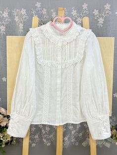 Crafted from soft, breathable cotton, this long-sleeved blouse features a lace-up on cuffs, the front is adorned with delicate scalloped eyelet trim. Ideal for both casual and formal occasions, this versatile piece can be paired effortlessly with skirts or layered under dresses for a chic look.   	 		 			Size 			S 			M 			L 			XL 			2XL 		 		 			Shoulders 			34 			35 			36 			37 			38 		 		 			Bust 			90 			94 			98 			102 			106 		 		 			Waist 			84 			88 			92 			96 			100 		 		 			Sleeve Leng Steampunk Fashion Female, Steampunk Fashion Male, Gothic Skirts, Blouse Lace, Sleeves Blouse, Chiffon Long Sleeve, Under Dress, Mesh Long Sleeve, Band Collar