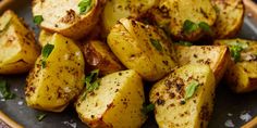 cooked potatoes with herbs and seasoning on a plate