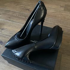 Authentic, Lovely (Nwt/Box) Saint Laurent Black Leather Stiletto Heels! These Heels Make A Statement! Corset Design On Back Make Them Unique! Heel Height 5.5 Inches, Platform .75 Inches. Pointed Toe, Size 40 (Us 10). They Run Small!! Comes With Box, Dust Bag, Heel Replacements (Receipt Available). Open To Reasonable Offers Only! No Low Ball Offers!!!! Thank You For Looking! No Trades. My Packages Ship Everyday (Mon.-Fri.) Occasionally Saturdays Calf Leather Heels With Sculpted Heel For Night Out, Calf Leather Heels With 4-inch Heel For Night Out, Calf Leather High Heel Court Shoes For Party, High Heel Calf Leather Court Shoes For Party, Calf Leather High Heels For Evening, Luxury Platform Heels For Workwear, Formal Platform Heels In Calf Leather, Elegant Calf Leather Heels For Night Out, Calf Leather Almond Toe Heels For Night Out