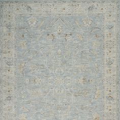 an area rug with blue and beige colors