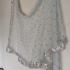 More dupatta here in our collection https://www.etsy.com/shop/neelcreations/?section_id=15880219 Perfect eye catcher blue Silver Dupatta with sequins. This Indian dupatta is made of net and has mirror border with beads. Net is very light blue in color and has mirror like embroidery. Border mirrors are real mirrors This can be your wedding dress chunni for Indian occasion wear for festival. This has perfect bling for you to look classy and ethnic at same time. . This can even be your home decorat Bollywood Style Light Blue Dupatta With Mirror Work, Blue Wedding Dupatta With Border Detail, Light Blue Wedding Dupatta With Mirror Work, Elegant Blue Dupatta With Border, Transitional Blue Dupatta With Mirror Work, Silver Dupatta, Red Indian Wedding, Indian Dupatta, Mirror Border