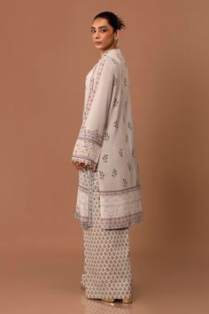 Brand: Sana SafinazProduct Code: H243-008B-2ACCollection: Mahay by Sana Safinaz Unstitched Winter CollectionFabric: Linen DESIGN DETAILS: Digital Printed Shirt Front On Linen 1.15 Meters Digital Printed Shirt Back On Linen 1.15 Meters Digital Printed Sleeves On Linen 0.65 Meters Embroidered Patti On Organza 1 Meter Rotary Printed Cambric Pants 1.75 Meters DISCLAIMER:* Lining, Laces, and Tassels are not included in unstitched variants.* Embellishment items in stitched outfits are subject to market availability.* Product color may vary due to photographic lighting or your device settings. CARE INSTRUCTIONS: Extra Fabric Has Been Used For Shoot Original Color May Vary Slightly From The Picture Dry Clean Recommended Iron The Clothes At Moderate Temperature Do Not Use Bleach, Or Stain Removing Linen Design, Sana Safinaz, Basic Wear, Embroidered Linen, Cozy Vibes, Extra Fabric, Fabric Stores Online, Printed Linen, Printed Sleeves