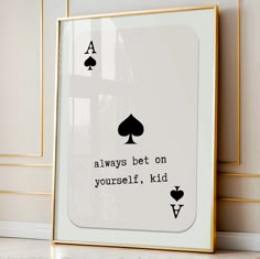 a framed card game with the words always bet on yourself, kid and spades