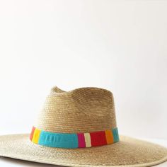 The Sandra hat is created with palm fronds harvested from the banks of the Chixoy River, and accented with the brightly colored bands that are hand loomed by our talented Guatemalan female artisans. // note the hat's name: a nod to its talented maker. This hat collection is both sustainable and a fair trade partnership. With every hat purchase you make, we are able to continue sending orders to our talented partners giving them the means to support their families. Details: Permanent woven band a Colorful Hat, Island Life Style, Out To Lunch, Palm Fronds, Women Artisans, Trim Color, Hat Band, Hand Loom, Sun Hat