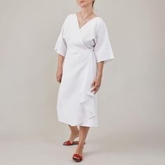 Explore our Handcrafted White Linen Wrap Dress for Women, featuring a flattering half-sleeve midi design with a tie waist for an adjustable fit. This dress includes side pockets and a V-neck cut, with the back of the skirt lined to prevent any transparency, ensuring elegance and comfort. Ideal for everyday city life, work engagements, leisure outings, and perfect as a summer vacation dress. Available in a variety of colors, from light beige to dark brown, along with shades of blue and more. Shou Half Sleeve Summer Midi Dress For Workwear, Summer Workwear Midi Dress With Half Sleeve, Belted Short Sleeve Wrap Dress For Brunch, Belted Half Sleeve Midi Dress For Work, Summer Half Sleeve Dress With Tie Waist, Belted Midi Length Wrap Dress For Daywear, Belted Wrap Midi Dress For Daywear, Short Sleeve Midi Dress With Tie Waist For Brunch, Belted Wrap Dress In Midi Length For Daywear