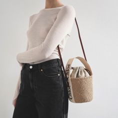 Brown raffia bucket bag with white detailing from Chloé. The Woody tote bag is handwoven from partly upcycled materials by independent craftswomen in Kenya. It features a drawstring fastening and a long leather strap for shoulder and crossbody wear. It is complete with an embroidered Chloé logo for graphic contrast and signature touch.Measurements: L17 x H16 x W16cmMade in Italy Chic Natural Color Bucket Bags, Chic Natural Bucket Bag With Top Handle, Chic Natural Color Top Handle Bucket Bag, Eco-friendly Top Handle Bucket Bag With Leather Handles, Eco-friendly Bucket Bag With Leather Handles, Eco-friendly Bucket Bag With Braided Handles, Chic Bucket Straw Bag With Adjustable Strap, Chic Everyday Straw Bucket Bag, Chic Everyday Bucket Straw Bag