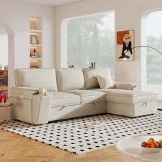 a living room filled with white furniture and lots of windows on top of the wall