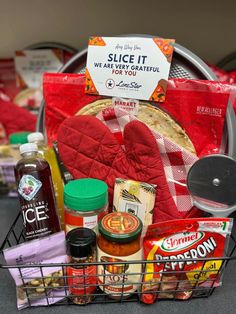 a basket filled with lots of food and condiments