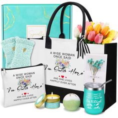 a woman's birthday gift bag with flowers and other items