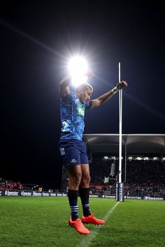 a man standing on top of a soccer field