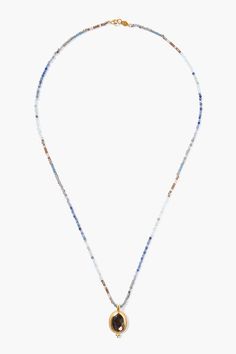 Alternating rows of blue toned gems and crystals create a beautiful ombré pattern in this vibrant beaded necklace with a shimmering gold framed hypersthene pendant.18k gold plated sterling silver, iolite, lapis, sodalite, blue topaz, labradorite, hypersthene, crystals.22" in length.Handmade in Vietnam. Gems And Crystals, Czech Jewelry, Necklace Charms, Handmade Box, Making Things, Brass Necklace, Beaded Top, Gold Plated Sterling Silver, Gold Frame