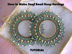 two beaded hoop earrings sitting on top of a pillow with the words how to make seed bead hoop earrings