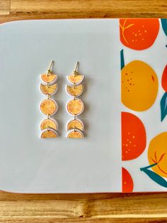 polymer clay lightweight orange moon phase earrings perfect for summer gold plated stainless steel ball posts Orange Dangle Earrings Polymer Clay, Orange Dangle Earrings In Polymer Clay, Orange Dangle Polymer Clay Earrings, Orange Dangle Polymer Clay Jewelry, Orange Polymer Clay Dangle Earrings, Orange Dangle Jewelry In Polymer Clay, Orange Polymer Clay Dangle Jewelry, Orange Clay Earrings, Summer Clay Earrings